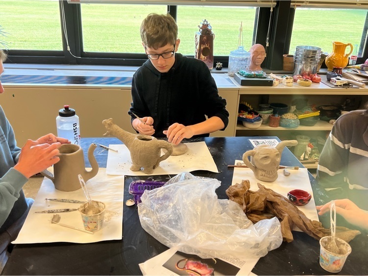 students working on their clay projects